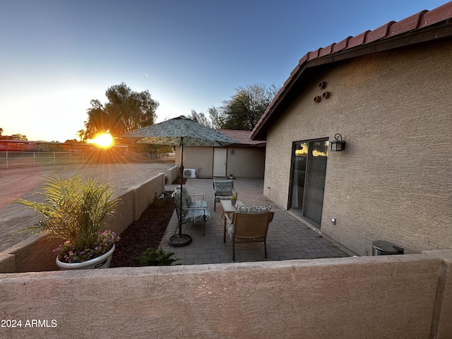 view of patio terrace at dusk