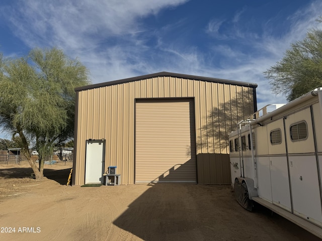 view of outbuilding with a garage