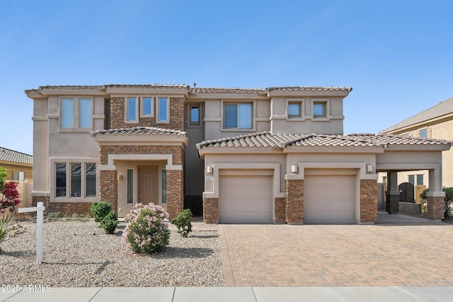 5557 W Mine Trl, Phoenix, AZ 85083 - view of front of home featuring stone siding, decorative driveway, and stucco siding