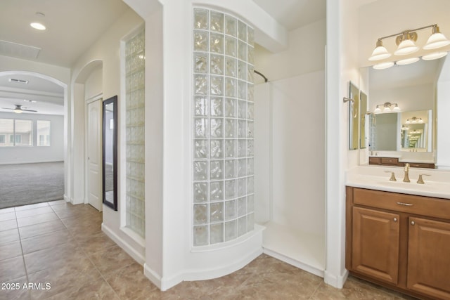 5557 W Mine Trl, Phoenix, AZ 85083 - full bathroom featuring walk in shower, ceiling fan, tile patterned flooring, and vanity