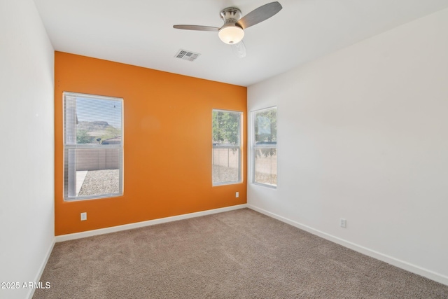 5557 W Mine Trl, Phoenix, AZ 85083 - unfurnished room featuring a ceiling fan, healthy amount of natural light, and carpet flooring