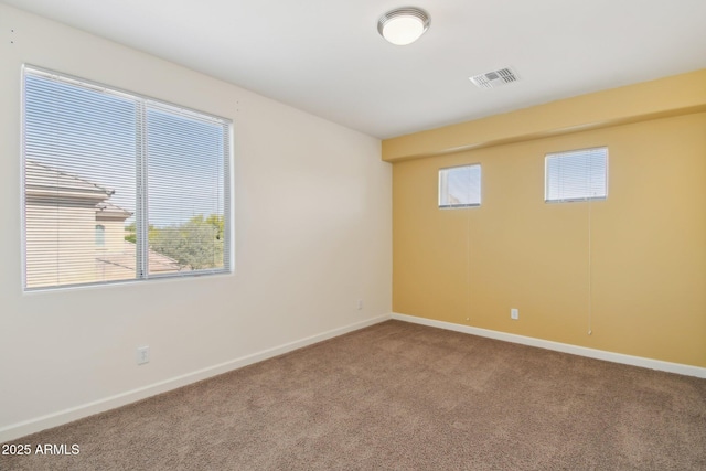 5557 W Mine Trl, Phoenix, AZ 85083 - spare room with carpet flooring, baseboards, and plenty of natural light