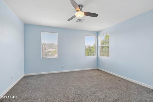 5557 W Mine Trl, Phoenix, AZ 85083 - carpeted empty room with healthy amount of natural light, ceiling fan, and baseboards