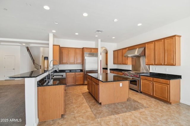 5557 W Mine Trl, Phoenix, AZ 85083 - kitchen with premium appliances, wall chimney exhaust hood, a sink, a center island, and recessed lighting