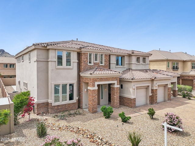 5557 W Mine Trl, Phoenix, AZ 85083 - view of front of property with stone siding, stucco siding, a tiled roof, and driveway