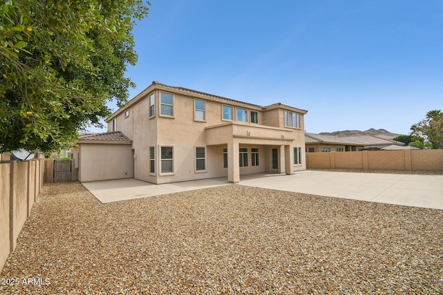 5557 W Mine Trl, Phoenix, AZ 85083 - rear view of property with a tiled roof, a patio area, a fenced backyard, and stucco siding