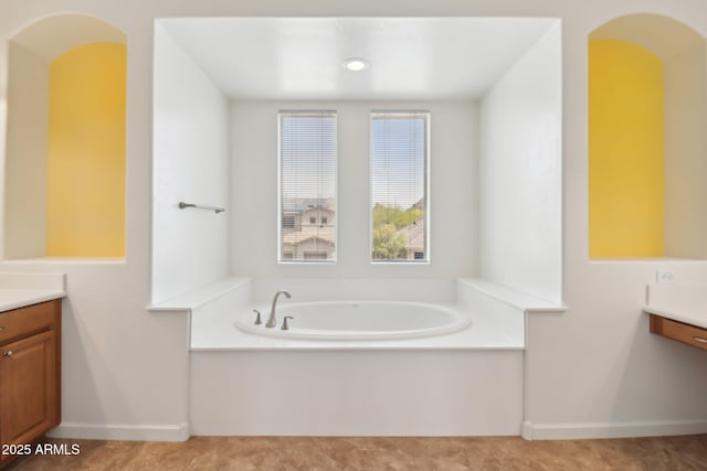 5557 W Mine Trl, Phoenix, AZ 85083 - full bathroom with vanity, a bath, and baseboards