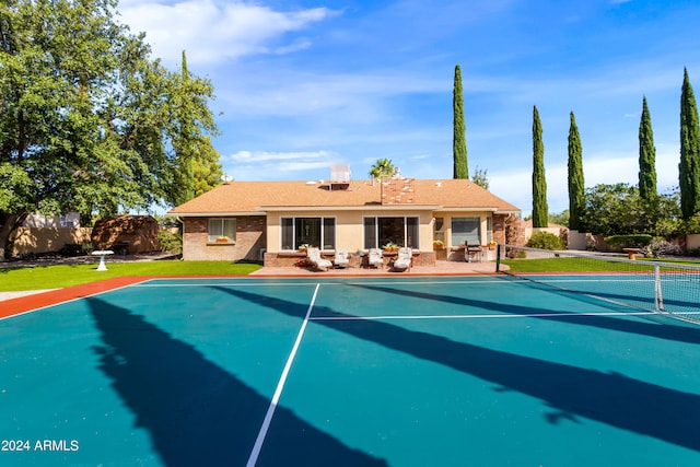 view of swimming pool featuring tennis court