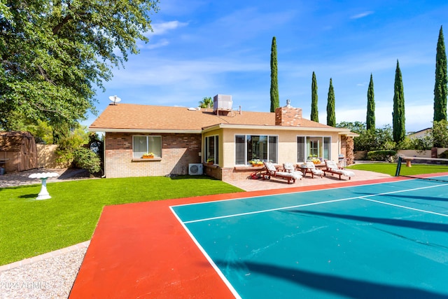 back of house featuring a patio, tennis court, central AC, and a lawn