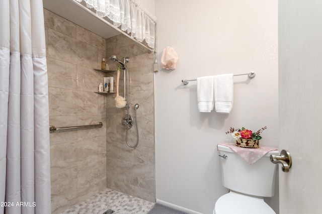 bathroom with toilet and curtained shower