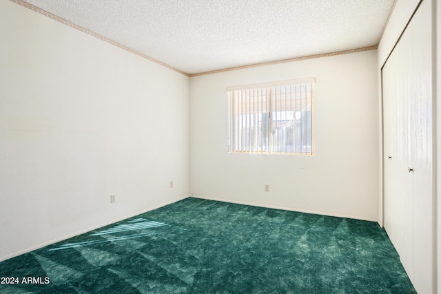 unfurnished bedroom featuring a closet, dark carpet, and a textured ceiling