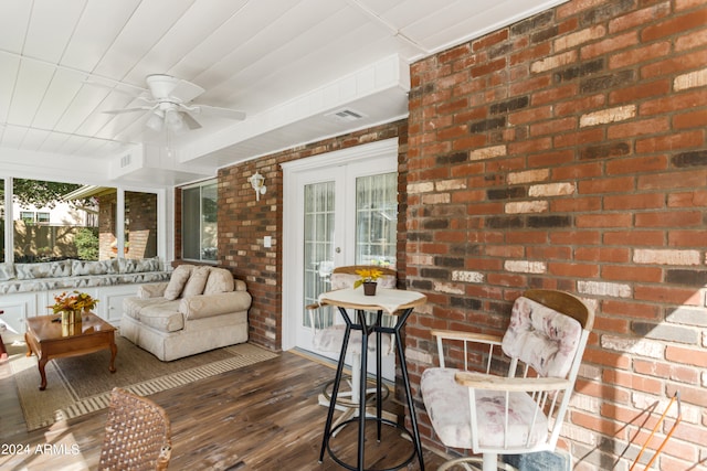 sunroom with ceiling fan and french doors