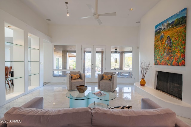 living room featuring french doors and ceiling fan