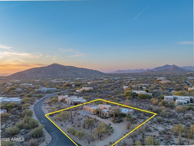 aerial view at dusk with a mountain view