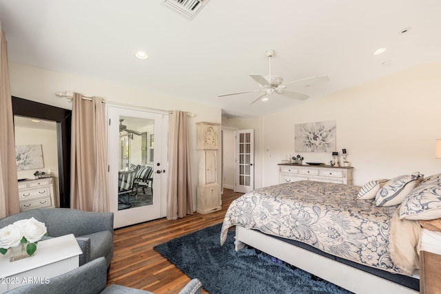 bedroom featuring wood finished floors, access to exterior, ceiling fan, visible vents, and lofted ceiling