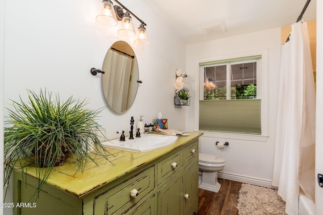 full bathroom with toilet, wood finished floors, vanity, and a shower with shower curtain