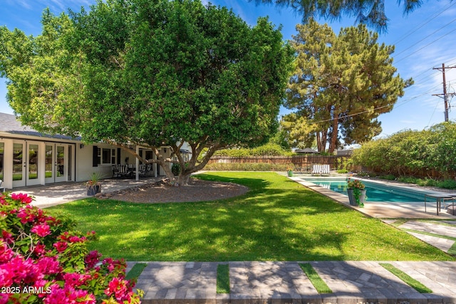 view of yard with a patio, a fenced in pool, and a fenced backyard