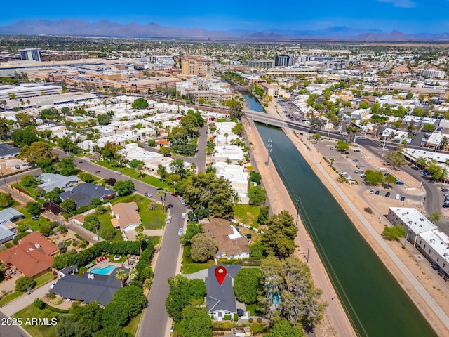 bird's eye view with a residential view and a water and mountain view