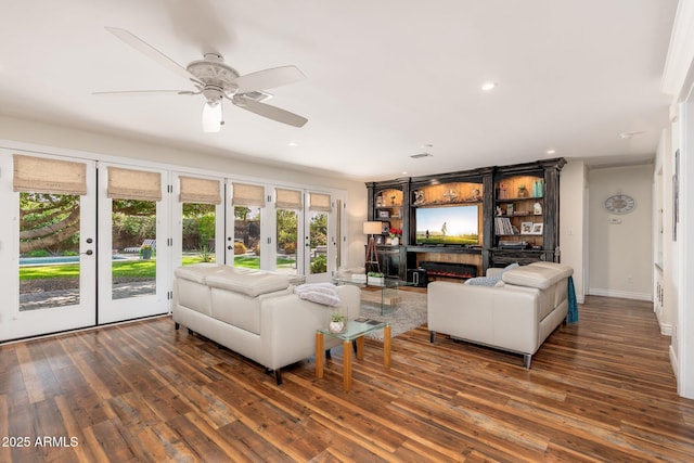 living room with recessed lighting, wood finished floors, ceiling fan, baseboards, and french doors
