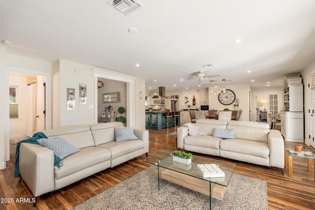 living room featuring visible vents, wood finished floors, ceiling fan, and recessed lighting