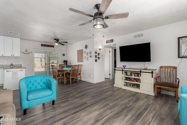 living room with dark hardwood / wood-style flooring and ceiling fan