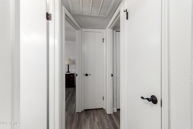 corridor featuring dark hardwood / wood-style flooring