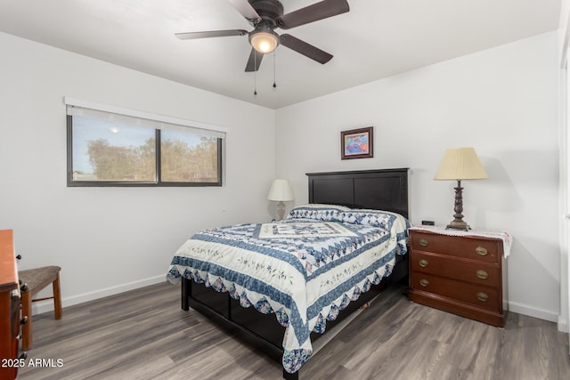 bedroom featuring dark hardwood / wood-style flooring and ceiling fan