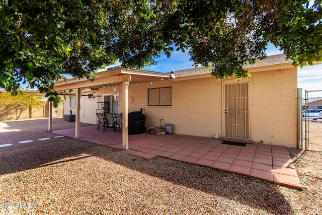 rear view of property with a patio area