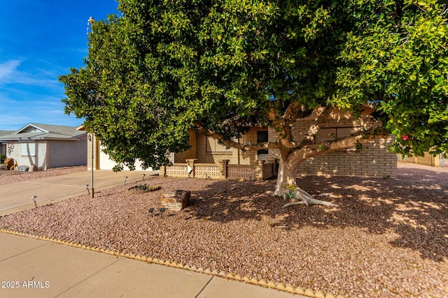 view of property hidden behind natural elements