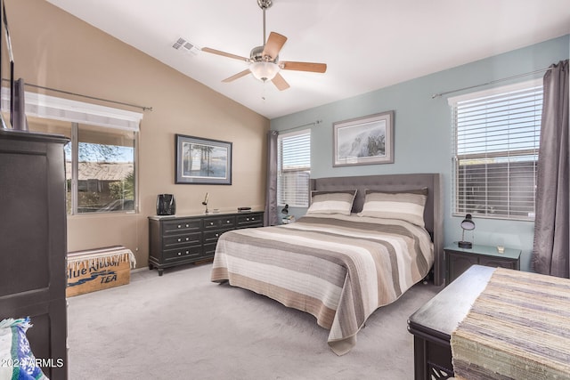 bedroom featuring ceiling fan, light carpet, and vaulted ceiling