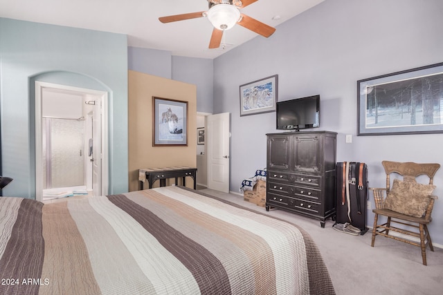 carpeted bedroom featuring ceiling fan and ensuite bath