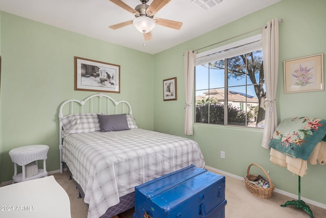 bedroom with ceiling fan and carpet