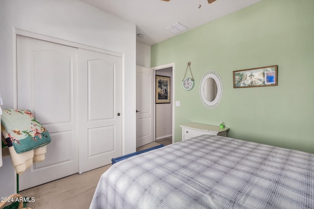 carpeted bedroom featuring a closet