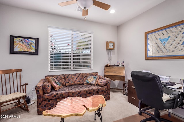 office with light carpet and ceiling fan