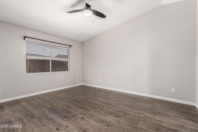 unfurnished room with dark wood-style floors, ceiling fan, and baseboards