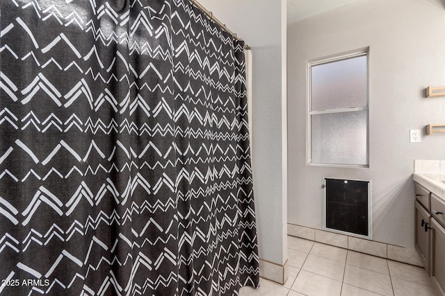 bathroom with vanity, a shower with shower curtain, and tile patterned floors