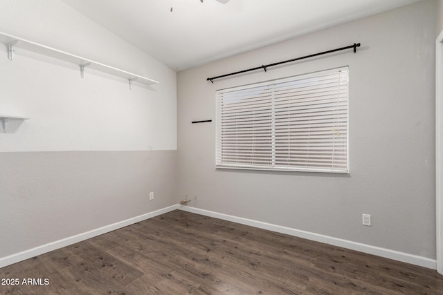 unfurnished room featuring wood finished floors and baseboards