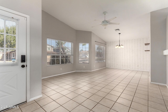 interior space with light tile patterned floors, vaulted ceiling, plenty of natural light, and visible vents