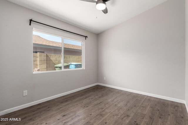 spare room with a ceiling fan, baseboards, and wood finished floors