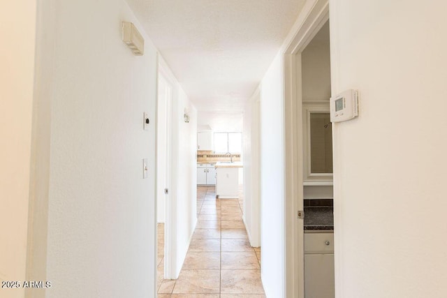 1315 Via Cabrillo, Sierra Vista, AZ 85635 - corridor featuring light tile patterned floors and a sink