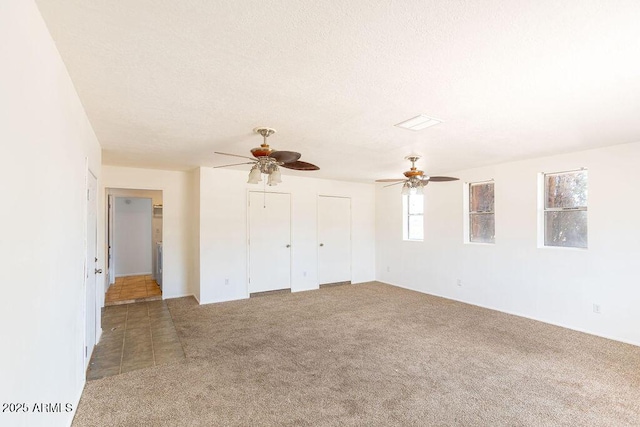 1315 Via Cabrillo, Sierra Vista, AZ 85635 - unfurnished living room featuring carpet flooring, ceiling fan, and a textured ceiling