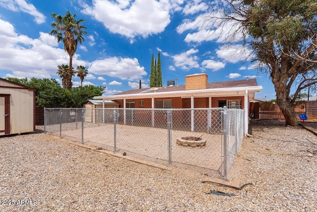 1315 Via Cabrillo, Sierra Vista, AZ 85635 - back of house featuring a fenced backyard, a patio, and a chimney