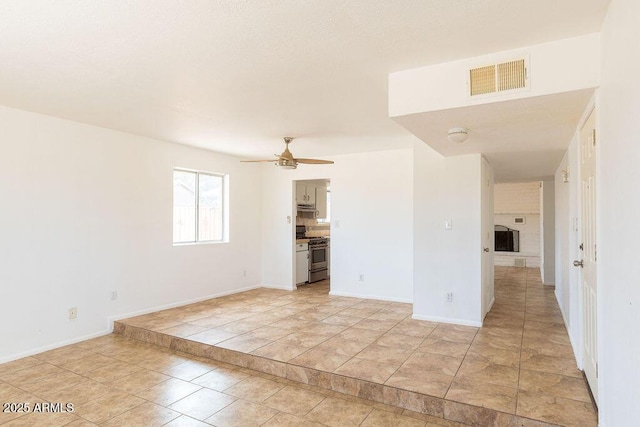 1315 Via Cabrillo, Sierra Vista, AZ 85635 - spare room with ceiling fan, light tile patterned flooring, and baseboards
