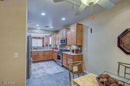 kitchen featuring stainless steel appliances and ceiling fan