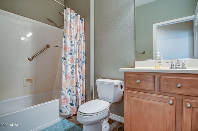 full bathroom featuring shower / bath combination with curtain, toilet, and vanity