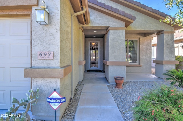 entrance to property featuring a garage