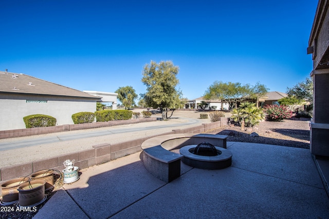 view of patio / terrace featuring a fire pit