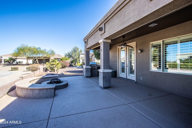 view of patio / terrace featuring area for grilling, an outdoor fire pit, and ceiling fan