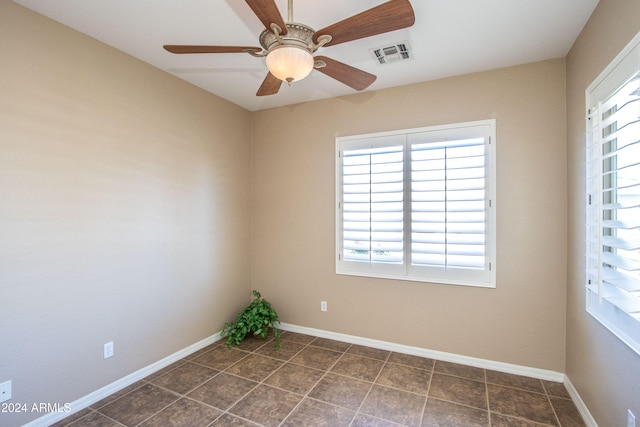 unfurnished room with ceiling fan