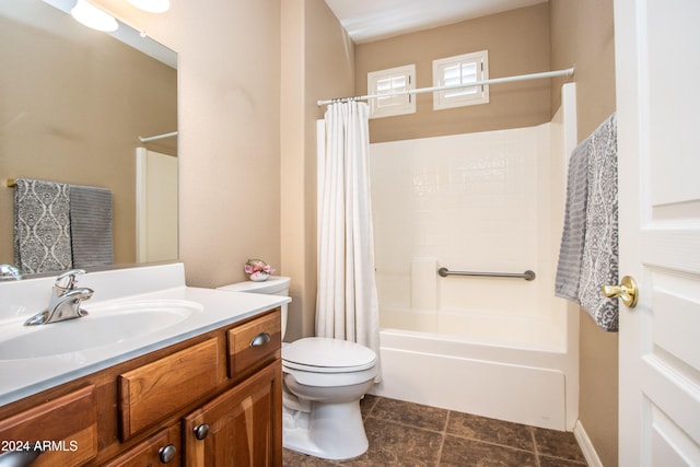 full bathroom featuring tile patterned flooring, vanity, toilet, and shower / tub combo